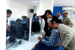 Shri Prateek Hajela (IAS), Commissioner & Secretary, Home & Political Deptt, Govt. of Assam and State Coordinator, NRC and Dimbeswar Kalita (Rtd. ACS) Additional State Consultant for NRC seen helping a public in searching for the record in the Legacy Data at the Model NRC Seva Kendra ion Noonmai, Guwahati