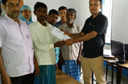 A man receives his Legacy Data Record in Hatipara GP under Goroimari Revenue Circle in Kamrup District