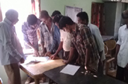 Public gathers at an NSK in Golaghat District and looks up for their record at the Legacy Data during the Statutory Publication of Legacy Data phase